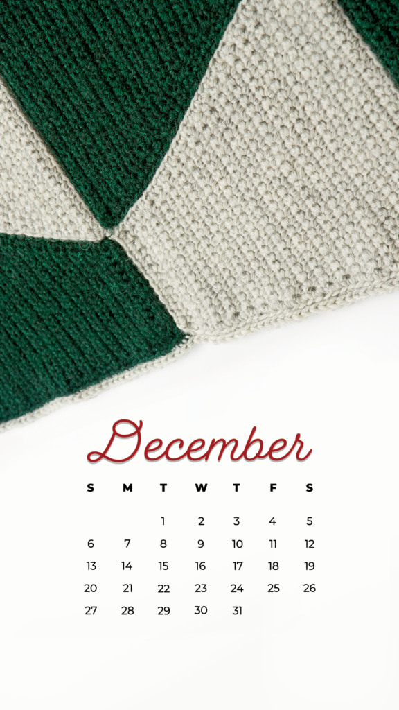 The edge of a crocheted blanket and a December 2021 calendar
