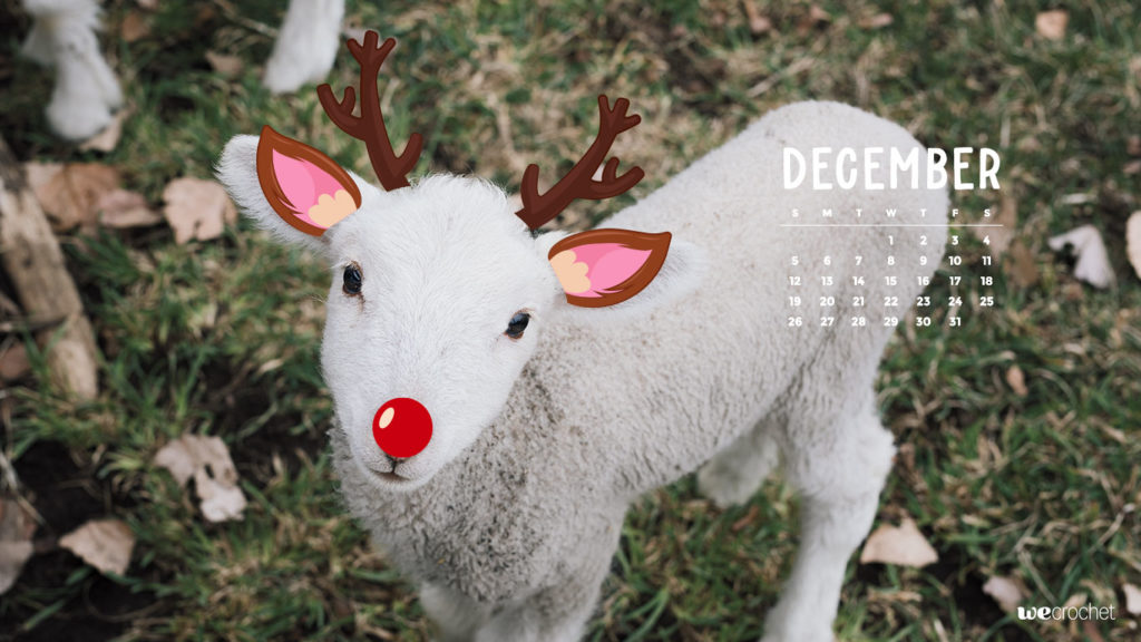 A December 2022 calendar with a photo of a little lamb with cartoon deer ears, antlers and a red nose