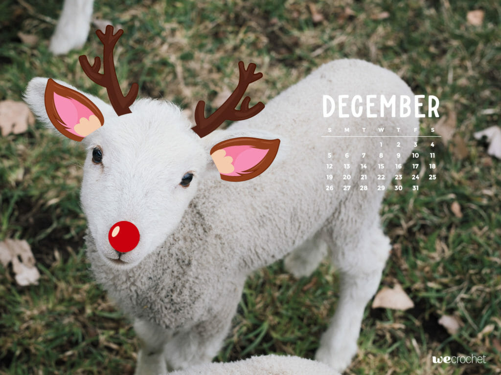 A December 2022 calendar with a photo of a little lamb with cartoon deer ears, antlers and a red nose