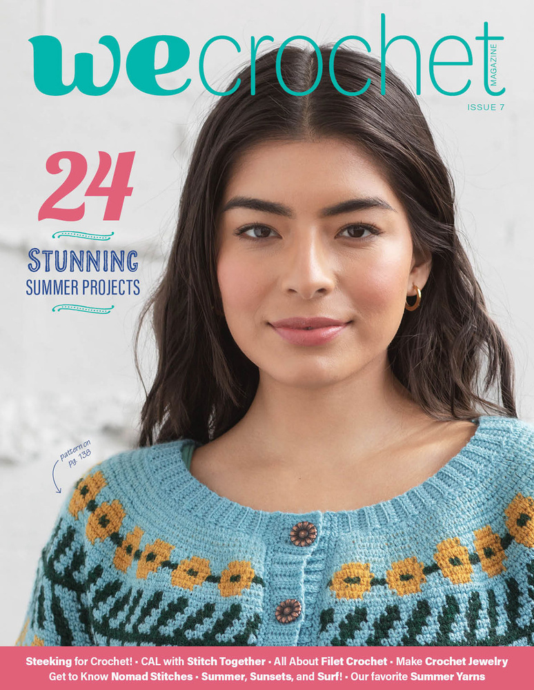 WeCrochet magazine Issue 7 cover: a woman wears a hand-crocheted sweater in turquoise with flowers surrounding the yoke in yellow and green.